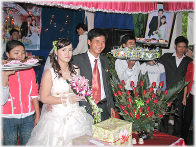 Couple presenting the food to the guests.