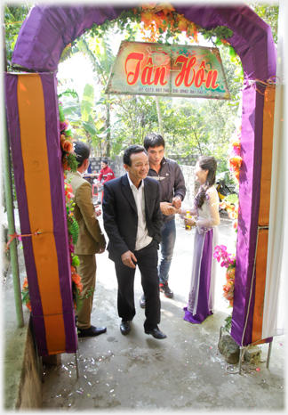 Couple greeting guests.