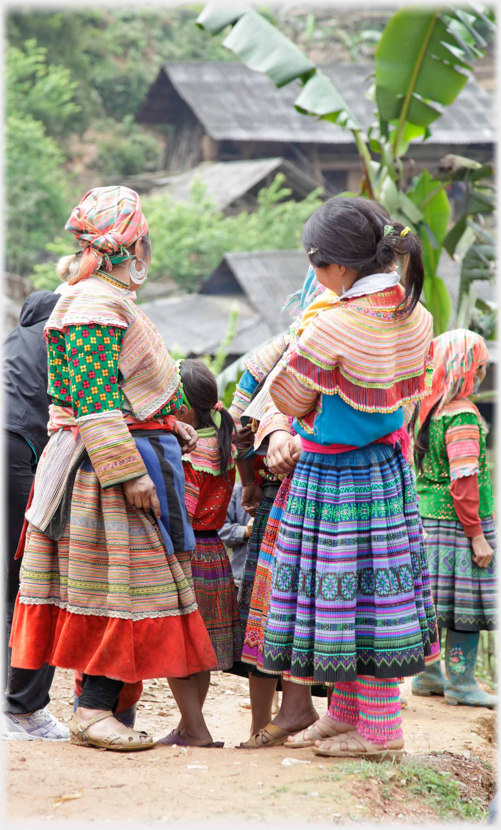 Rear view of two Hmong women.