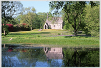 Chapel reflected in pool.