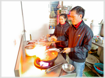 Two people cooking.