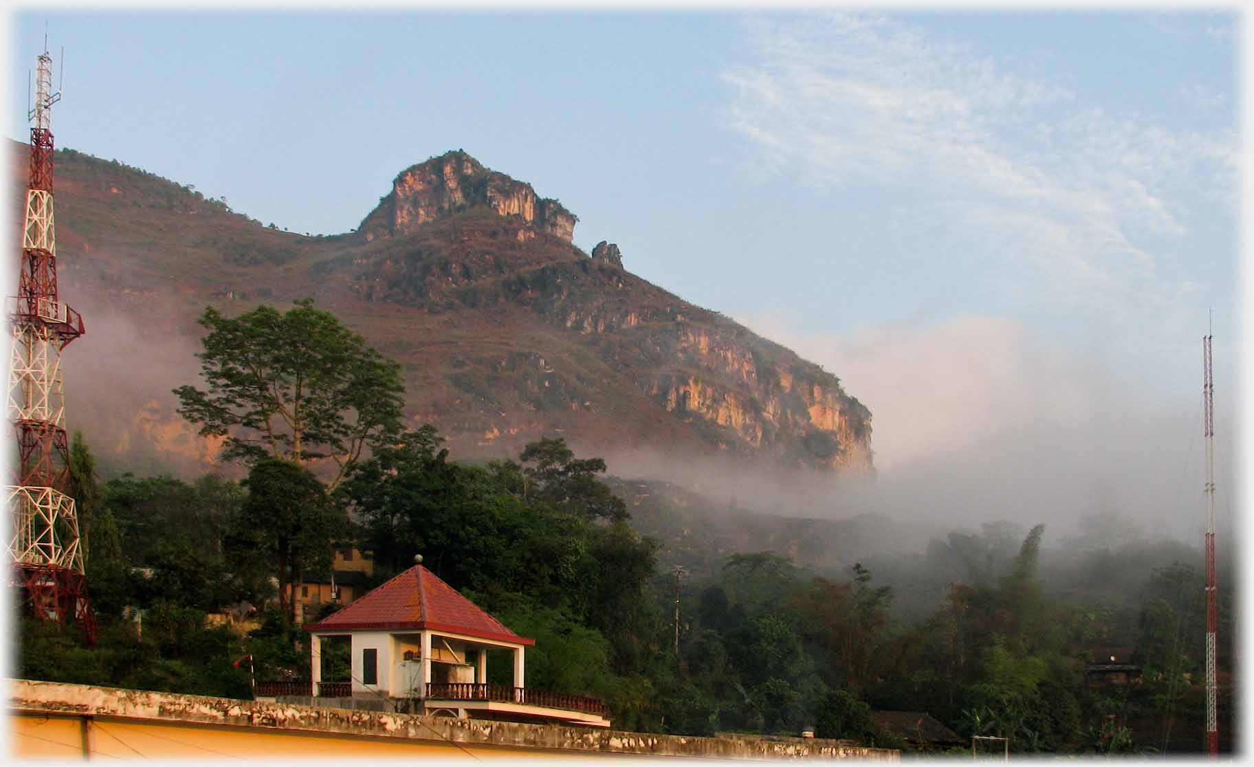 Curiously topped hill with vertical cliff faces.