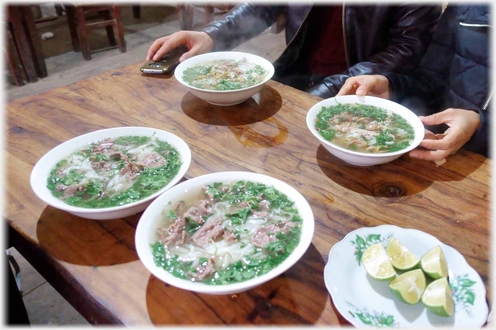 Four bowls of pho.