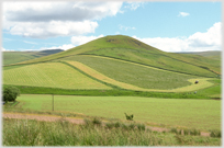 Hill with curving track marked around it.