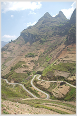 Precipitous mountain with terracing visible in places.