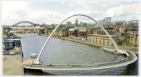 Footbridge over river within high arch.