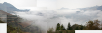 Composite of hills with clouds lying between them.
