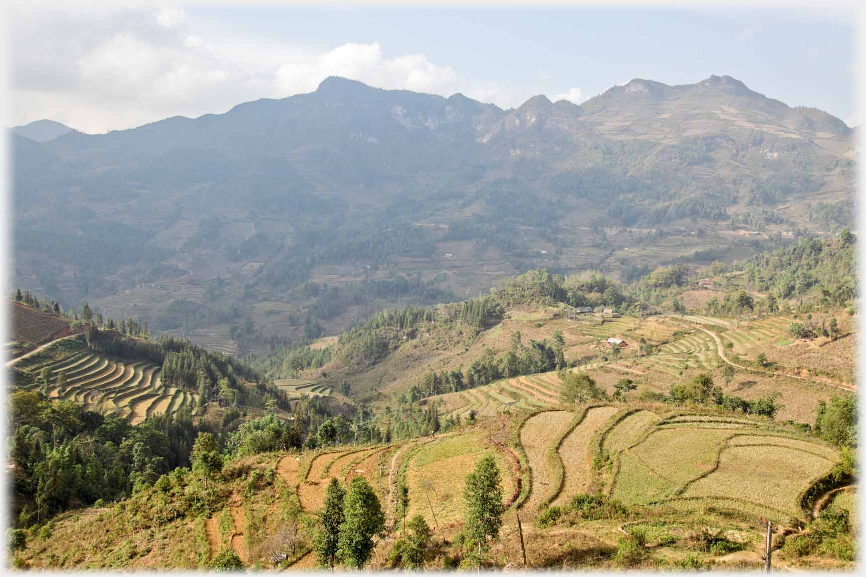 Terraced foreground mountains beyond.
